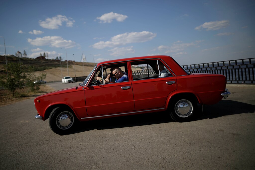 Gretar Jonsson, an Iceland supporter sits in a Lada car, on a street in Volgograd, Russia, June 20, 2018. As well as shooting all the matches, Reuters photographers are producing pictures showing their own quirky view from the sidelines of the World Cup. REUTERS/Ueslei Marcelino