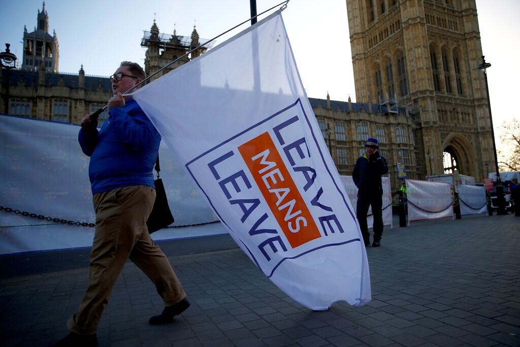 A pro-Brexit demonstrator walks past the Houses of Parliament in London, Britain, 8 January 2019.