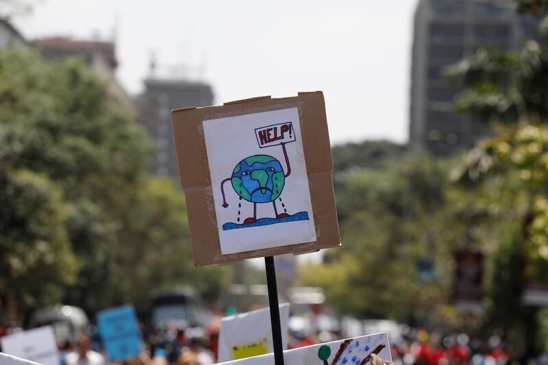 A sign carried by environmental activists is seen during the Climate strike protest calling for action on climate change, in Nairobi, Kenya, September 20, 2019. REUTERS/Baz Ratner - RC16E7BB4230