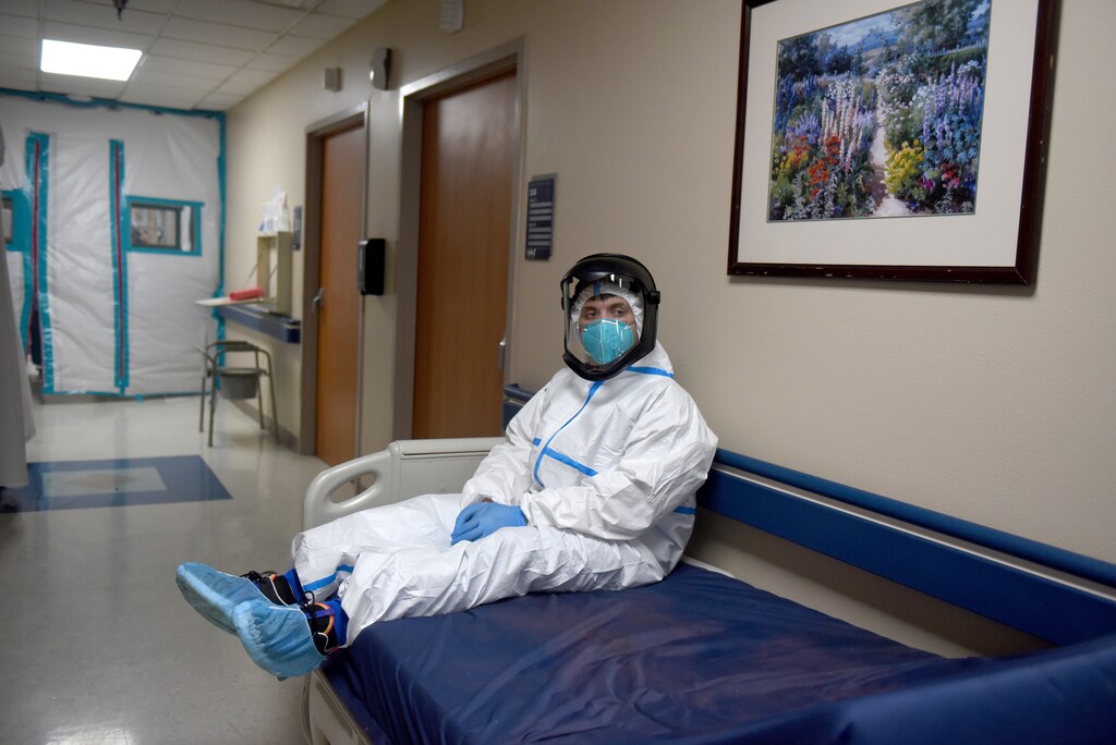 Gabriel Cervera briefly rests on an empty hospital bed within the coronavirus disease (COVID-19) unit at United Memorial Medical Center in Houston, Texas, U.S., December 30, 2020. REUTERS/Callaghan O'Hare - RC22YK9GIT0W