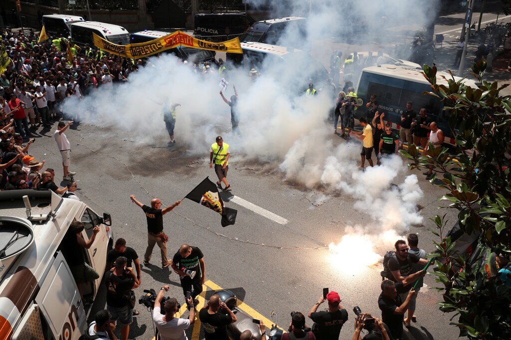 Taxi drivers hold a protest during a strike against what they say is unfair competition from ride-hailing and car-sharing services such as Uber and Cabify in Barcelona, July 2018.