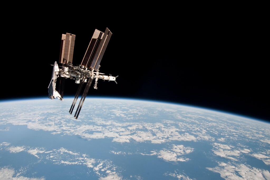 The International Space Station is seen with the docked space shuttle Endeavour in this photo provided by NASA and taken May 23, 2011. The photo was taken by Expedition 27 crew member Paolo Nespoli from the Soyuz TMA-20 following its undocking and is the first-ever image of a space shuttle docked to the International Space Station. REUTERS/NASA/Handout (UNITED STATES - Tags: SCI TECH) FOR EDITORIAL USE ONLY. NOT FOR SALE FOR MARKETING OR ADVERTISING CAMPAIGNS. THIS IMAGE HAS BEEN SUPPLIED BY A THIRD PARTY. IT IS DISTRIBUTED, EXACTLY AS RECEIVED BY REUTERS, AS A SERVICE TO CLIENTS - RTR2NEY1
