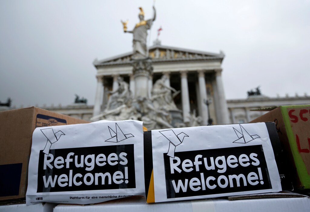 "Refugees welcome" is written on a wall made of carton boxes during a protest for a better asylum law in front of the Parliament in Vienna, Austria, April 25, 2016. REUTERS/Leonhard Foeger - D1AETALEQBAA
