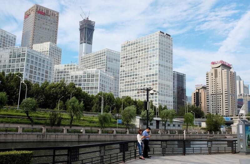 People rest at a park near Beijing's central business area, China August 29, 2017. Picture taken August 29, 2017. REUTERS/Jason Lee - RC13EF0BDDE0