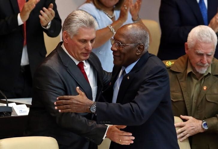 Newly elected Cuban President Miguel Diaz-Canel (L) reacts with First Vice-President Salvador Antonio Valdes Mesa during the National Assembly in Havana, Cuba, April 19, 2018. Alejandro Ernesto/Pool via REUTERS