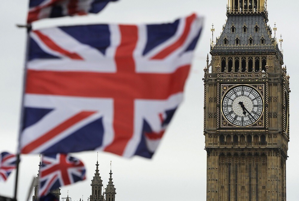 Flags are seen above a souvenir kiosk near Big Ben clock at the Houses of Parliament in central London June 26, 2012. Britain's landmark Big Ben clock tower adjoining the Houses of Parliament will be renamed "Elizabeth Tower" to mark Queen Elizabeth's 60th year on the throne, a parliamentary official said on Tuesday. REUTERS/Paul Hackett
