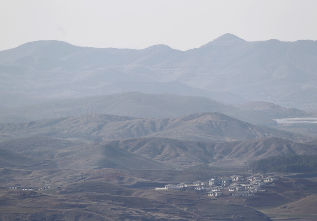 A North Korean village is seen near the demilitarized zone (DMZ) separating North Korea and South Korea, in this picture taken from an observation post in South Korea, just south of the DMZ in Paju, north of Seoul April 7, 2013. China deplored rising tension on the Korean peninsula on Sunday but said its embassy was operating normally in the North Korean capital and it asked authorities there to ensure its diplomats and other citizens were kept safe. REUTERS/Lee Jae-Won (SOUTH KOREA - Tags: MILITARY POLITICS)