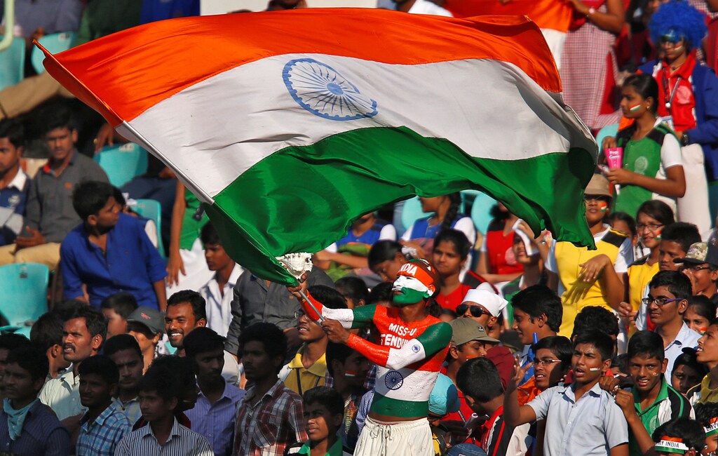 Cricket - India v England - Second Test cricket match - Dr. Y.S. Rajasekhara Reddy ACA-VDCA Cricket Stadium, Visakhapatnam, India - 19/11/16. A fan waves an Indian flag during the match. REUTERS/Danish Siddiqui - S1AEUNSMFKAB