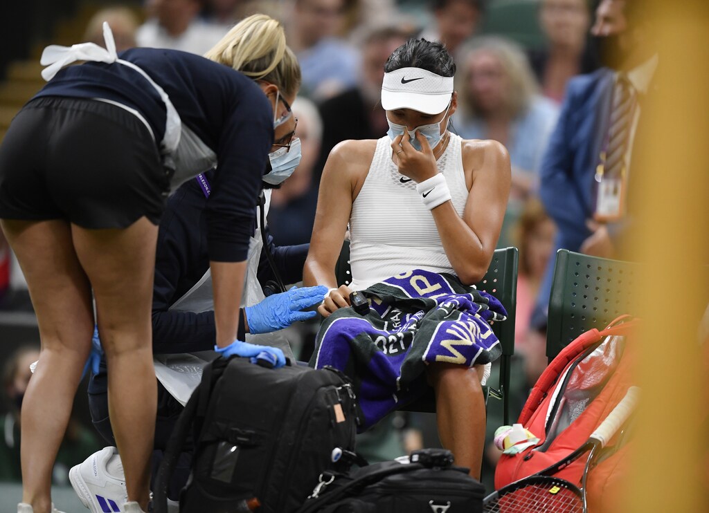 Tennis - Wimbledon - All England Lawn Tennis and Croquet Club, London, Britain - July 5, 2021 Britain's Emma Raducanu receives medical attention during her fourth round match against Australia's Ajla Tomljanovic