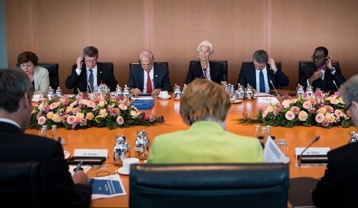 German Chancellor Angela Merkel meets Kristalina Georgieva, chief executive officer of the World Bank, Director-General Guy Ryder of the International Labor Organization, Jose Angel Gurria, Secretary-General of the Organisation for Economic Co-operation and Development (OECD, Christine Lagarde, head of the International Monetary Fund (IMF), Roberto Azevedo, Director-General of the World Trade Organization (WTO) and African Development Bank (AfDB) President Akinwumi Adesina for talks in Berlin, Germany, June 11, 2018. Bernd von Jutrczenka/Pool via Reuters