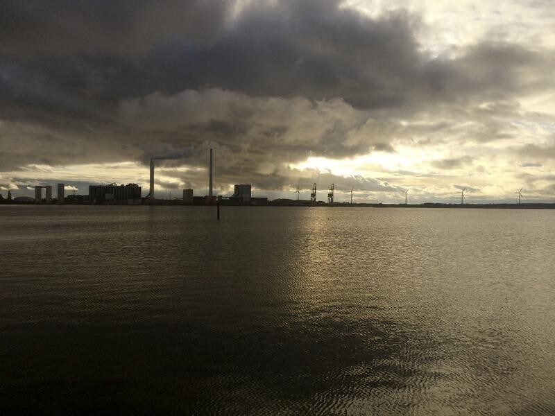 A general view shows DONG Energy's power station, which provides steam, ash and gypsum as waste products to other companies for their use in Kalundborg, Denmark, November 20, 2015. As pioneers of so-called industrial symbiosis, these companies swap waste and byproducts to cut costs and carbon dioxide (CO2) emissions profitably -- an approach that offers big business a financial incentive that could be crucial to nations striving to meet targets agreed at this month's global climate summit. Their success has attracted attention globally, with more than 30 corporate and municipal delegations from 20 countries visiting the town this year, including mayors from China's fast-growing Guandong province. To match story INDUSTRY-EMISSIONS/ REUTERS/Sabina Zawadzki - GF10000270461