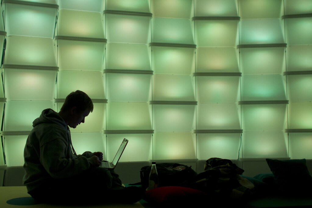 A woman uses a computer in the lounge area of the 27th Chaos Communication Congress (27C3) in Berlin, December 27, 2010. The annual four-day conference, organized by the Chaos Computer Club (CCC), offers lectures and workshops and attracts an international audience of hackers, scientists, artists, and utopians. REUTERS/Thomas Peter (GERMANY - Tags: SCI TECH) - GM1E6CS076W01