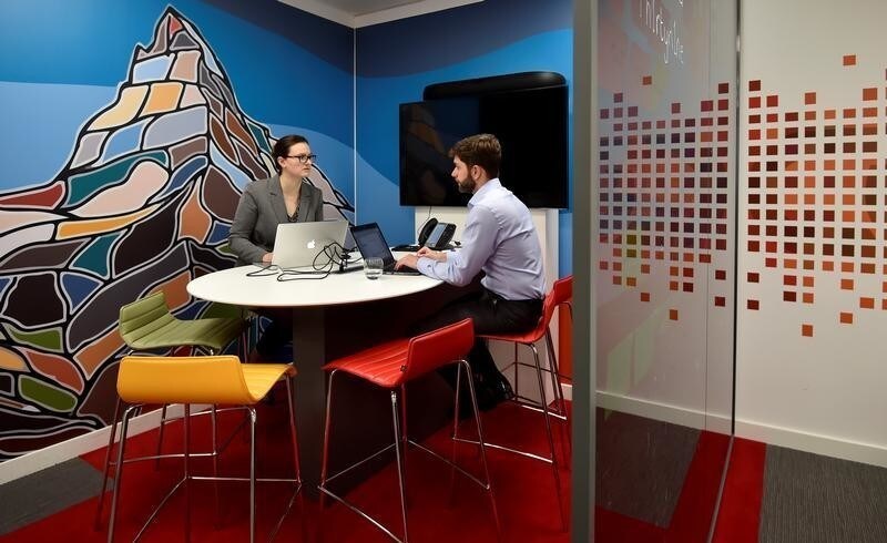 UBS employees work in the UBS "fintech lab" at Canary Wharf in London, Britain, October 19, 2016. REUTERS/Hannah McKay - RTX2PJIV