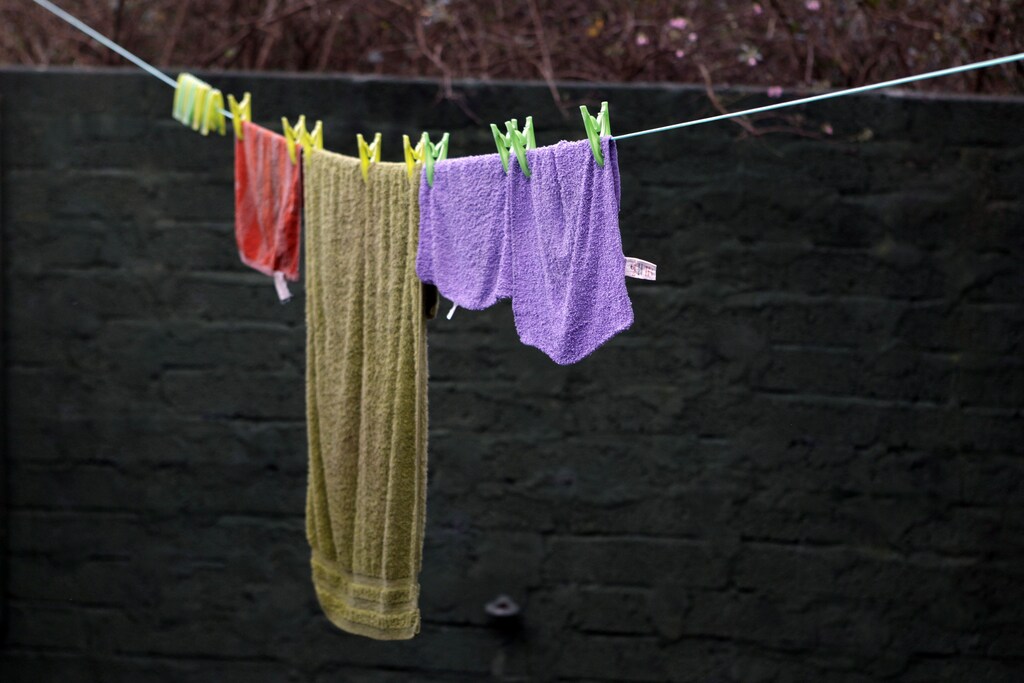 Laundry hangs to dry outside John McCarters wooden house in the hamlet of Downhill on the north coast of county Londonderry November 22, 2011. McCarter, age 77, has been living without electricity or central heating for the past 29 years. REUTERS/Cathal McNaughton (NORTHERN IRELAND - Tags: SOCIETY)