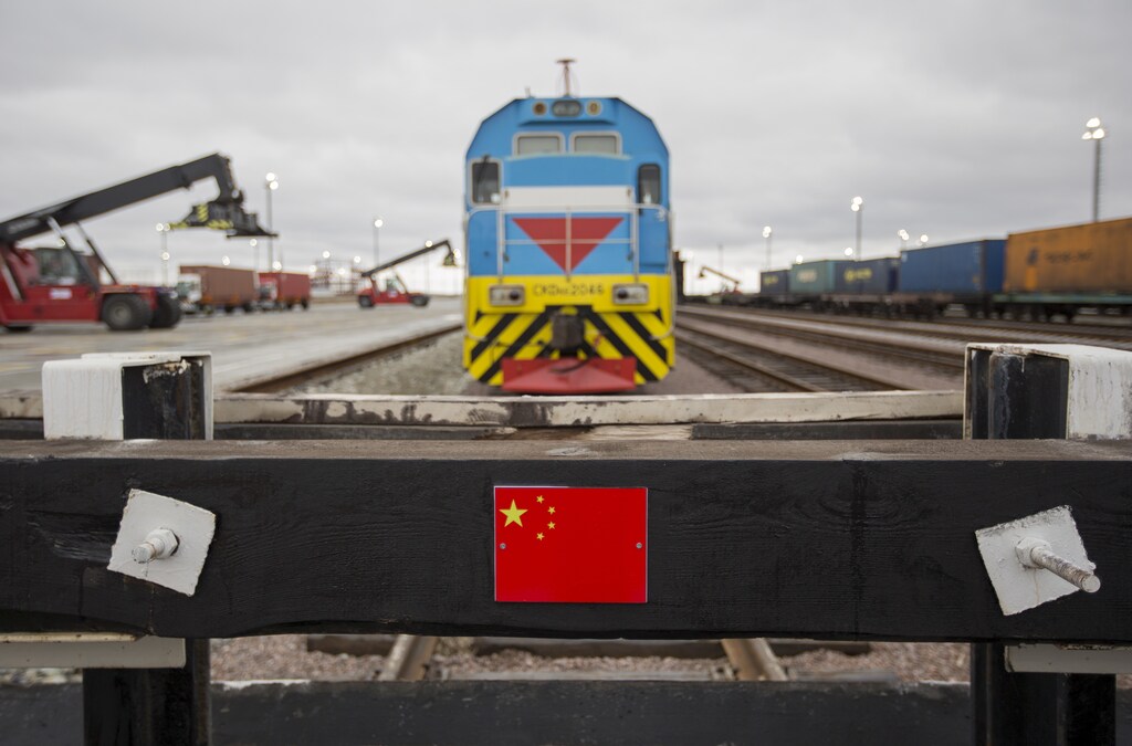 A Chinese flag marking a railway linked to China is seen in front of a train at the Khorgos border crossing point, east of the country's biggest city and commercial hub Almaty, Kazakhstan, October 19, 2015. Kazakhstan wants to establish itself as a major trading hub between China and Europe and get a share of a $600 billion market, but it will have to end tough, often time-wasting, regulations that hurt its reputation as a cross-border trading partner. Picture taken October 19, 2015. REUTERS/Shamil Zhumatov - RTX1TB7X