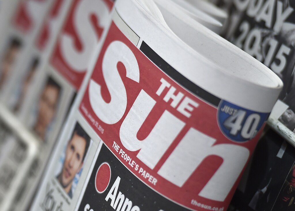 Copies of The Sun newspaper are seen on a newsstand outside a shop in central London January 20, 2015. Britain's The Sun tabloid, the country's best-selling newspaper, has decided to quietly stop publishing photographs of topless models on page three, ending a contested 44-year-old tradition of the Rupert Murdoch-owned paper, The Times reported on Tuesday. REUTERS/Toby Melville (BRITAIN - Tags: MEDIA BUSINESS) - RTR4M4YD