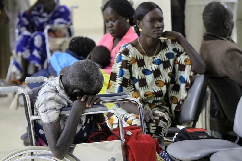 A disabled man waits with other South Sudanese volunteer returnees at the terminal in Khartoum Airport December 22, 2011. The U.N., International Organization for Migration (IOM), and the Sudan Government are helping disabled South Sudanese return to Juba, the capital of South Sudan, by air transport to avoid the 1,436 kilometres (892 miles) river journey which can take around 14 days to complete.