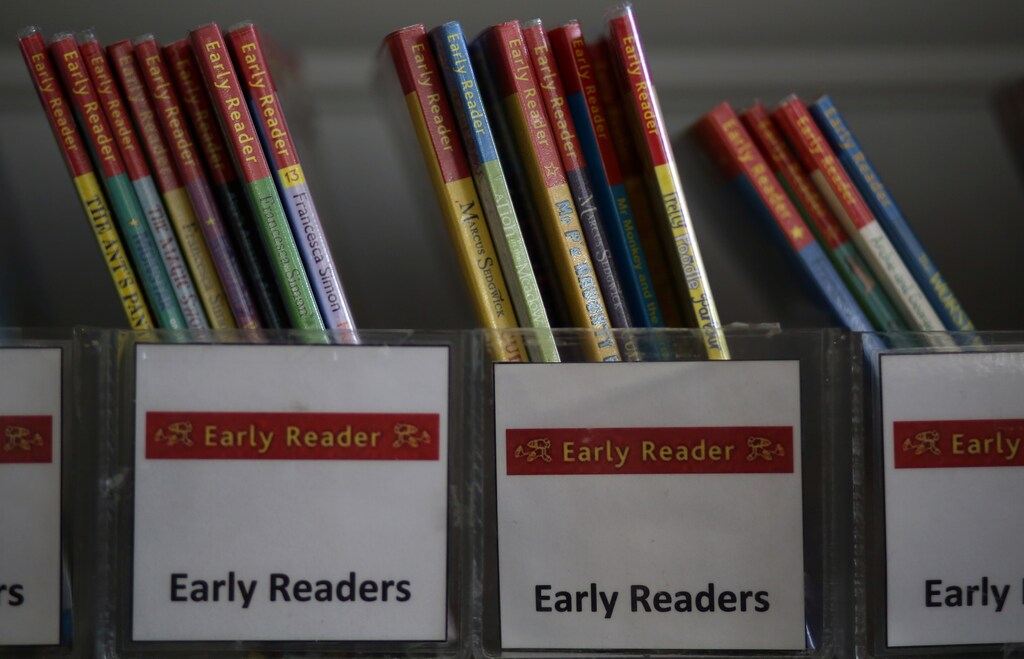 Children's reading books are seen on a shelf inside Widnes Library in Widnes, Britain September 12, 2018. REUTERS/Phil Noble - RC1FB98571B0