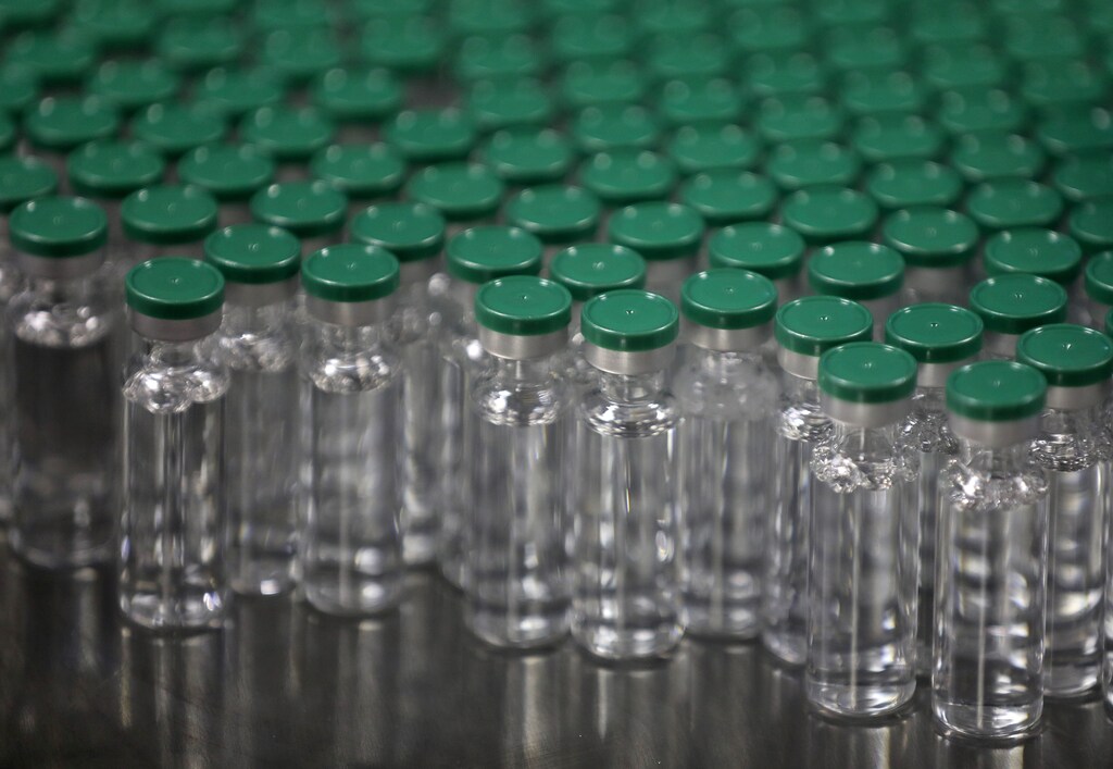 Vials of AstraZeneca's COVISHIELD, coronavirus disease vaccine, are packaged inside a lab at Serum Institute of India.