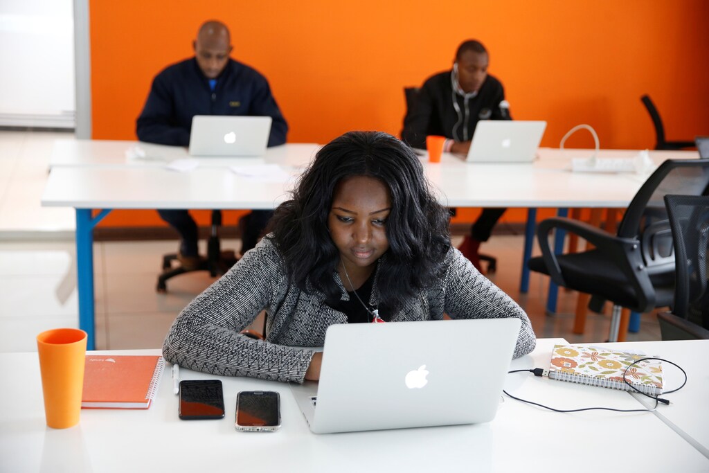 An employee of tech start-up Sendy, which offers online logistics services, works on her computer at their office in Nairobi, Kenya, October 30, 2018. Picture taken October 30, 2018. REUTERS/Baz Ratner - RC1FE1B5F060