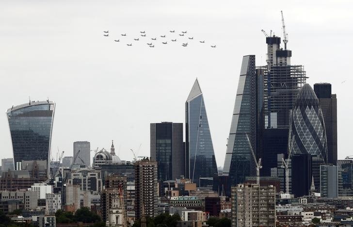 Typhoon jets take part in a flypast over the financial district to mark the centenary of the Royal Air Force (RAF) in London, Britain, July 10, 2018. REUTERS/Kevin Coombs