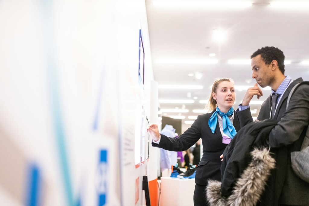 A woman and man are looking at a board: The future of jobs can reveal three possibilities