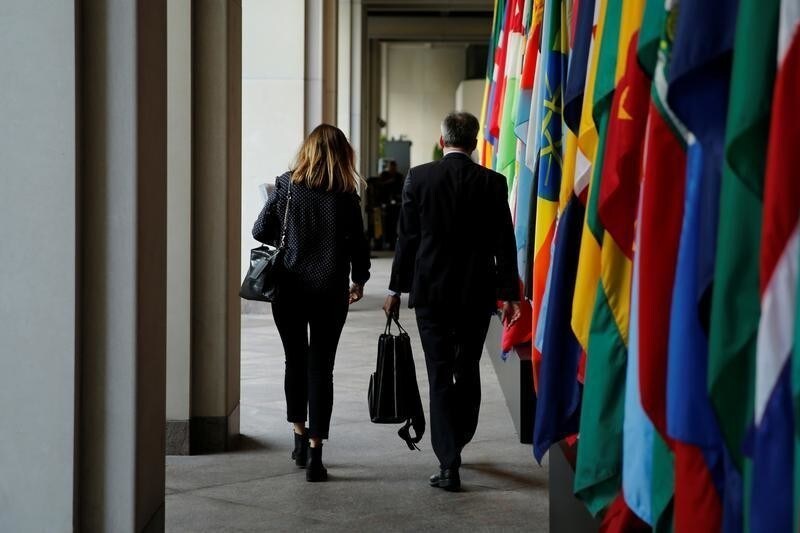 Delegates leave International Monetary Fund headquarters in the end of the day during the IMF/World Bank annual meetings in Washington, U.S., October 14, 2017.