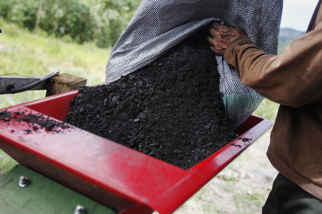 Biochar is harvested in Peru. Biochar is among the many innovations available to aid the push for decarbonization — but further uptake of this kind of technology is essential.