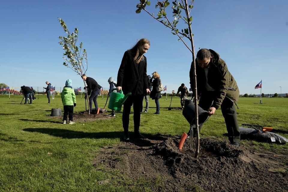 People plant trees in the Happy Tree park on World Cleanup Day in Jelgava, Latvia September 18, 2021.