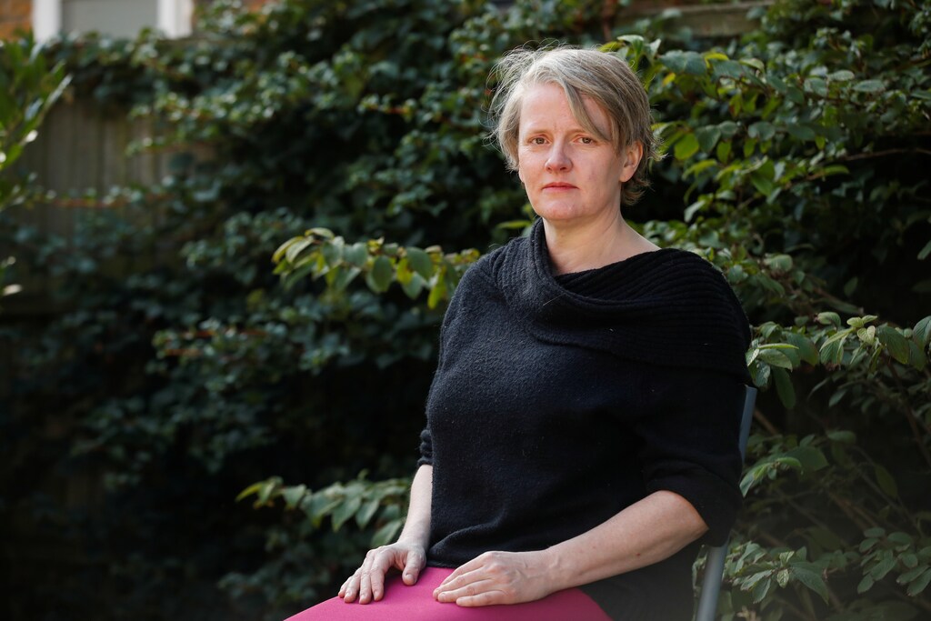 Felicity Callard, a 49-year-old British university professor and lecturer who suffered from the coronavirus disease (COVID-19), poses after an interview at her house in London, Britain, September 2, 2020. REUTERS/Matthew Childs - RC2SQI9KS94D