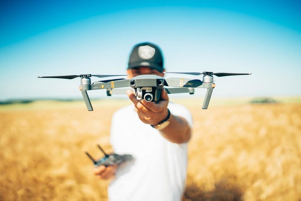 A person holding a drone
