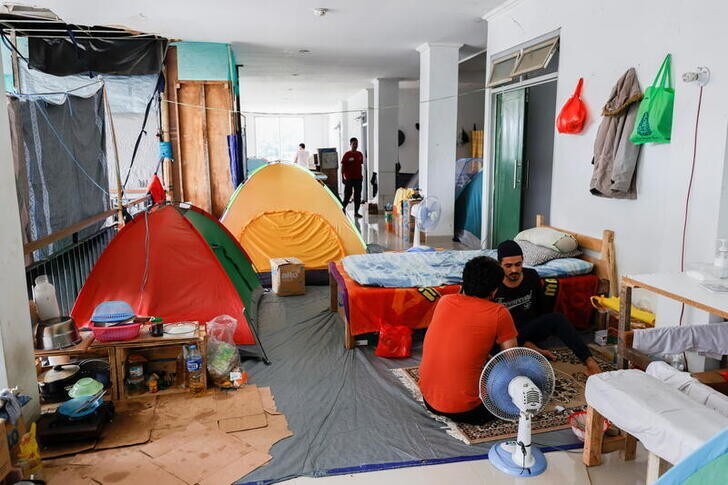 Camping tents are set up inside a former military building that is used as a temporary shelter for refugees, with most coming from Afghanistan, in Jakarta, Indonesia, August 31, 2021. REUTERS/Willy Kurniawan