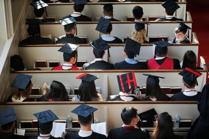 A graduating student has "HI" written on their cap at a service before the 365th Commencement Exercises at Harvard University in Cambridge, Massachusetts, U.S. May 26, 2016. REUTERS/Brian Snyder