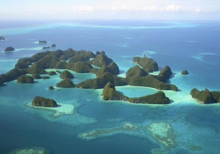 An aerial view of islands in Palau in this undated photo. Palau, a nation of sparsely populated Pacific islands surrounded by turquoise waters teeming with fish and giant clams, is so obscure most people must scour a map to find it. But with a crop of high-end resorts coming up, the islands may soon become a luxury tourist hotspot. To match Reuters Life! PALAU-TRAVEL/ REUTERS/Jackson Henry (PALAU SOCIETY TRAVEL) FOR EDITORIAL USE ONLY. NOT FOR SALE FOR MARKETING OR ADVERTISING CAMPAIGNS