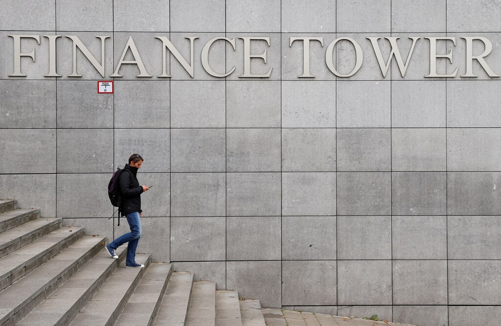 A woman walks past the Finance Tower in central Brussels, Belgium September 5, 2017. REUTERS/Francois Lenoir - RC16BDA8BE80