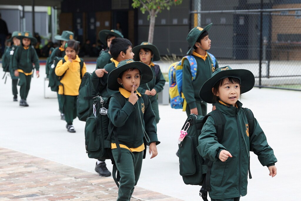 Children return to campus for the first day of New South Wales public schools fully re-opening for all students and staff amidst the easing of the coronavirus disease (COVID-19) restrictions at Homebush West Public School in Sydney, Australia, May 25, 2020. REUTERS/Loren Elliott - RC2CVG9TY5LS