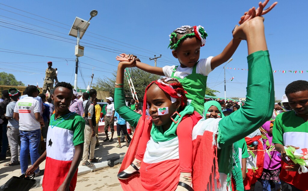 A girl sporting a sticker on her face with the colours of the national flag participates in a street parade to celebrate the 24th self-declared independence day for the breakaway Somaliland nation from Somalia in capital Hargeysa, May 18, 2015.