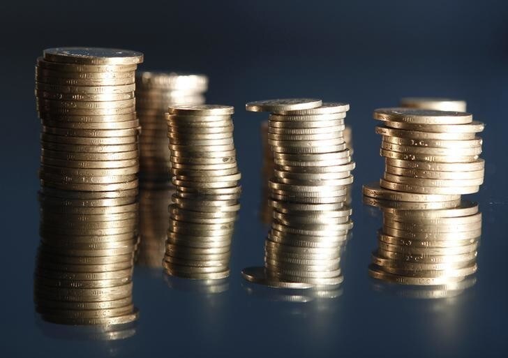 Stacks of Turkey's lira coins are seen in this picture illustration taken in Istanbul July 23, 2013. Turkey's central bank raised interest rates on Tuesday and said it would, if necessary, take further steps to stop the lira from falling. The move - a rise in the overnight lending rate to 7.25 percent from 6.5 percent - was a reaction to capital outflows that have knocked the lira down as much as 9 percent against the dollar. REUTERS/Osman Orsal (TURKEY - Tags: BUSINESS POLITICS)
