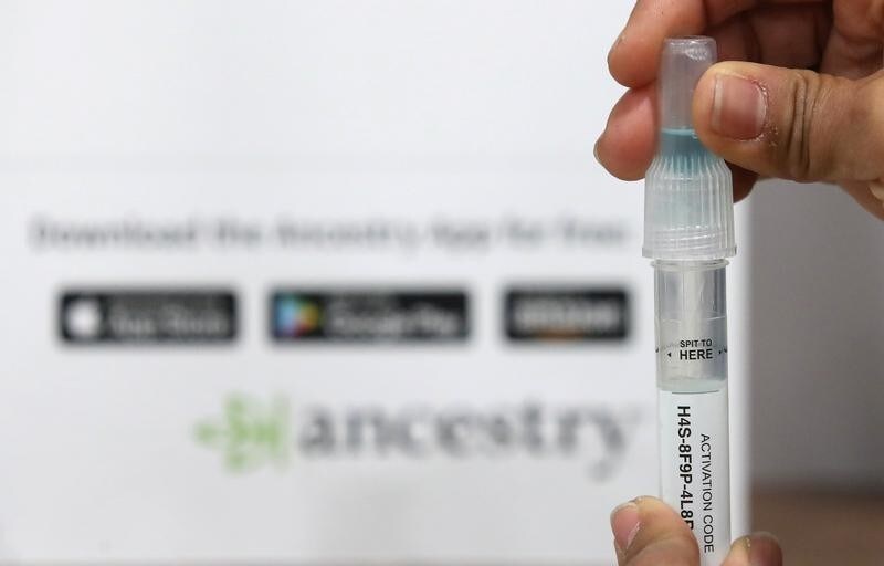 An employees of Ancestry.com prepares a tube with a saliva sample for shipment to demonstrate how to process a DNA kit at the 2019 RootsTech annual genealogical event in Salt Lake City, Utah, U.S., February 28, 2019. REUTERS/George Frey - RC164A870290