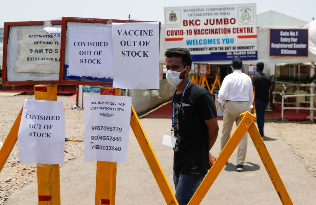 Notices about the shortage of COVISHIELD, a coronavirus disease (COVID-19) vaccine manufactured by Serum Institute of India, are seen outside a COVID-19 vaccination centre in Mumbai, India