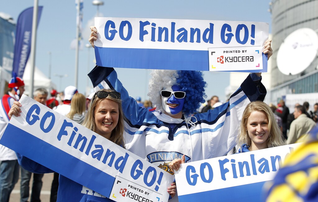 Supporters of Finland hold posters before the start of their 2012 IIHF men's ice hockey World Championship semi-final game against Russia in Helsinki May 19, 2012. REUTERS/Petr Josek (FINLAND - Tags: SPORT ICE HOCKEY) - LR2E85J0WB4C1