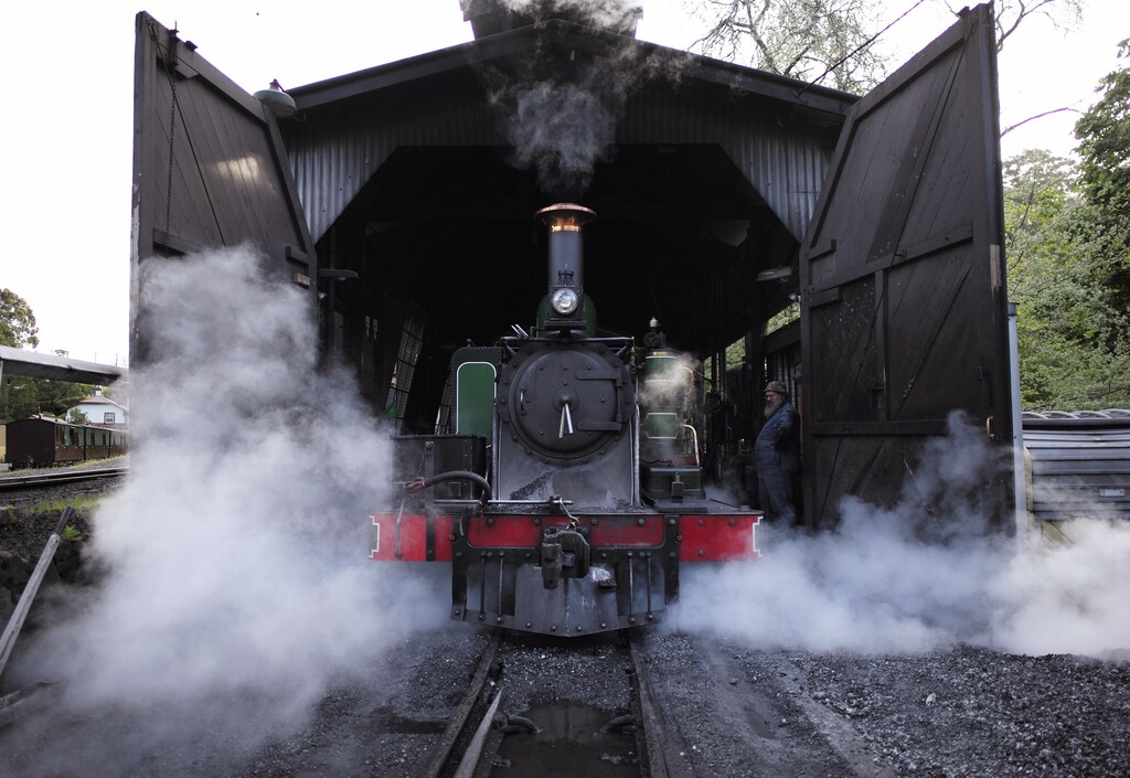 Puffing Billy steam locomotive 6A is reversed into the engine shed for the night at Belgrave station near Melbourne, October 17, 2014. While the discovery of steam power 200 years ago powered the Industrial Revolution, the world long ago shunted most steam trains onto the sidings of history. But in one small corner of rural Australia, the sights, sounds and smells of the Industrial Revolution remain very much alive. In the picturesque Dandenong Ranges on the eastern outskirts of Melbourne, Puffing Billy is Australia's last steam engine railway. Picture taken October 17, 2014. REUTERS/Jason Reed (AUSTRALIA - Tags: SOCIETY TRANSPORT TPX IMAGES OF THE DAY)ATTENTION EDITORS: PICTURE 13 OF 24 FOR WIDER IMAGE PACKAGE 'THE CHARM OF NARROW GAUGE FROM 1900'. TO FIND ALL IMAGES SEARCH 'DANDENONG' - RTR4CHVG