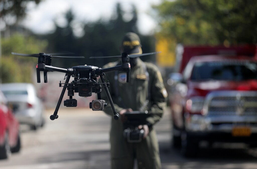 A Colombian police officer operates a drone that measures body temperature, in an area of high contagion amid the coronavirus disease (COVID-19) outbreak, in Bogota, Colombia May 20, 2020.