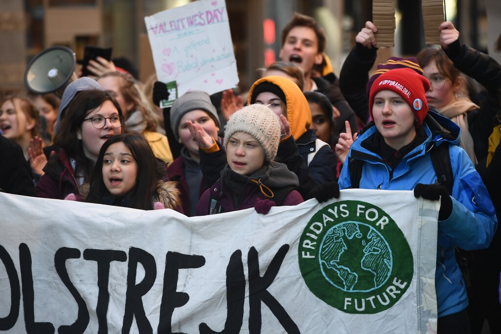Swedish environmental activist Greta Thunberg and other protesters attend the weekly "Fridays For Future" climate strike, at Mynttorget in Stockholm, Sweden February 14, 2020 TT News Agency/Ali Lorestani via REUTERS ATTENTION EDITORS - THIS IMAGE WAS PROVIDED BY A THIRD PARTY. SWEDEN OUT. NO COMMERCIAL OR EDITORIAL SALES IN SWEDEN. - RC2D0F93I96I