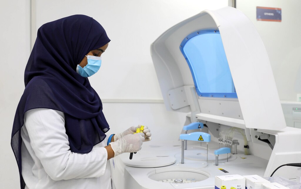 Laboratory technician Wardo Abdalla works inside the Medipark Diagnostics Lab that runs tests for the coronavirus disease (COVID-19), in Mogadishu, Somalia October 14, 2020. Picture taken October 14, 2020. REUTERS/Feisal Omar - RC2ZWJ9BT2X4