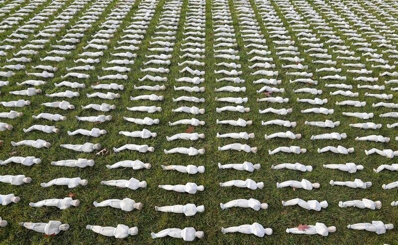 Captain James Pugh from the 1st Battalion of the Royal Anglian Regiment views some of the 72,396 shrouded figures that form part of the 'Shroud of the Somme' installation by British artist Rob Heard, in London's Queen Elizabeth Olympic Park, in Stratford, London, Britain November 7, 2018.