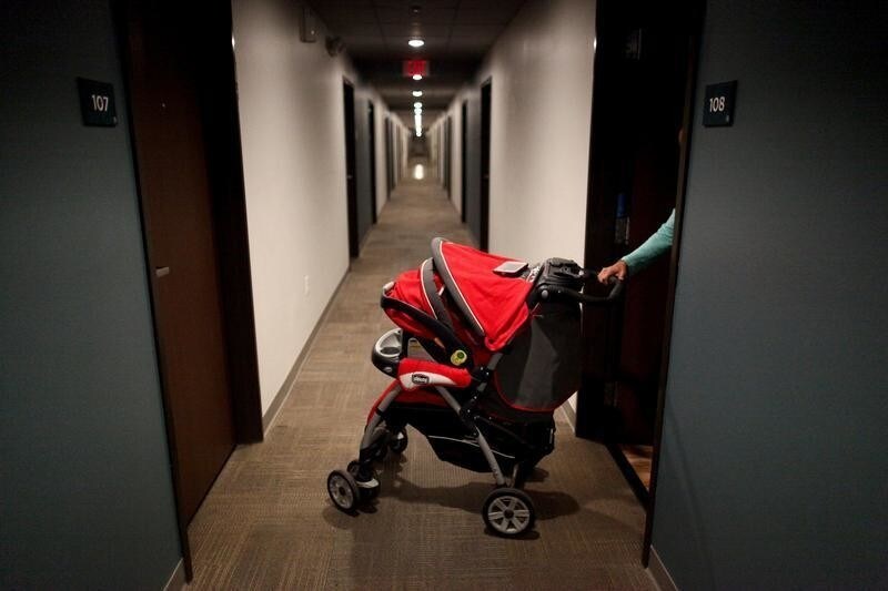 Puerto Rican Debora Oquendo, 43, pushes her baby pram into a hall of a hotel where she lives with her 10-month-old daughter, in Orlando, Florida, U.S., December 12, 2017. Oquendo and her baby girl Genesis Rivera share a hotel room in Orlando, temporarily paid for by Federal Emergency Management Agency. They fled Puerto Rico in October after Hurricane Maria destroyed their house. Oquendo, who found a part-time job that pays minimum wage, fears they will be homeless when that assistance runs out this month. "I don't have enough money to move to another place," Oquendo said. "I feel alone, and I'm afraid."