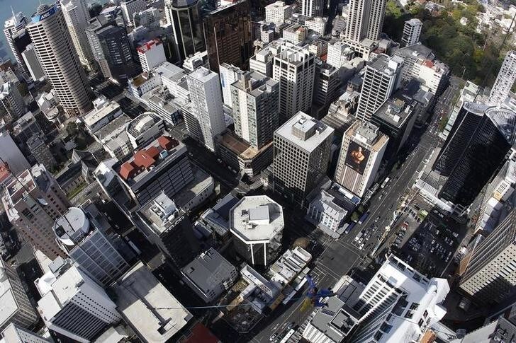Skyjumper Brad Smith performs a skyjump atop the Sky Tower in Auckland September 28, 2011. Picture taken with a fisheye lens. REUTERS/Stefan Wermuth (NEW ZEALAND)
