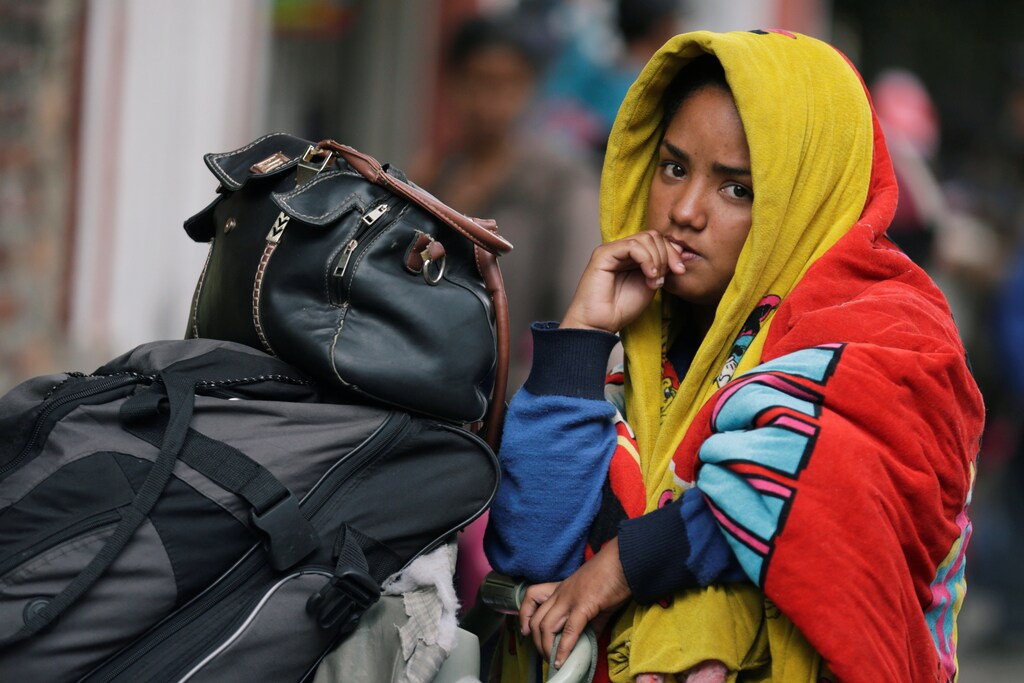 A Venezuelan migrant waits outside a temporary camp for Venezuelan refugees in Bogota, Colombia November 19, 2018. Picture taken November 19, 2018. REUTERS/Luisa Gonzalez - RC1A78A37720