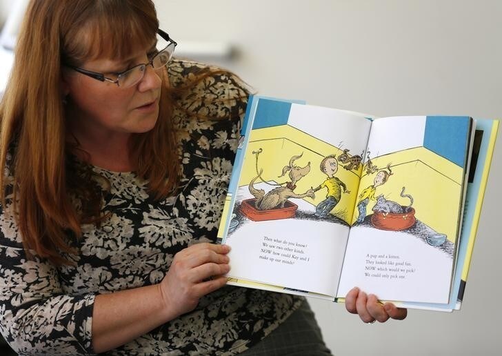 Reference librarian Marlayna Christensen reads to children Dr. Seuss' new book "What Pet Should I Get?" at the University of California San Diego's Geisel Library in San Diego, California July 28, 2015. The story is based on materials found two years ago in a box at the La Jolla home of Audrey Geisel, the widow of Theodor "Dr. Seuss" Geisel, who wrote the children's classics "The Cat in the Hat" and "Green Eggs and Ham". REUTERS/Mike Blake